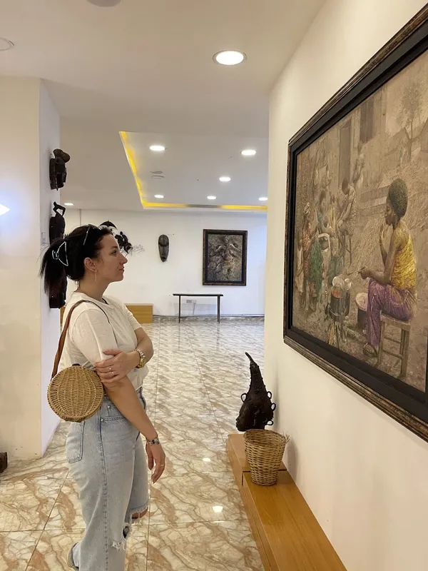 Visitor viewing African art in an Abuja gallery