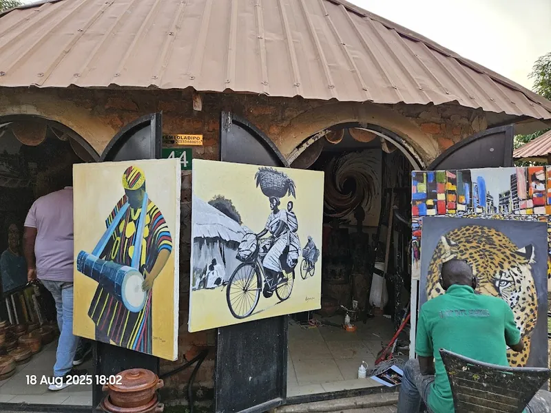 Colourful paintings on display at the Abuja Arts and Crafts Market